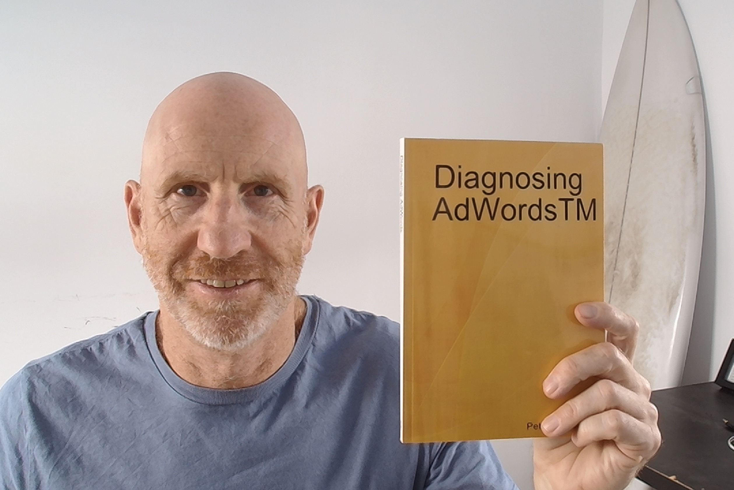 Pete Bowen holding a copy of Diagnosing Adwords